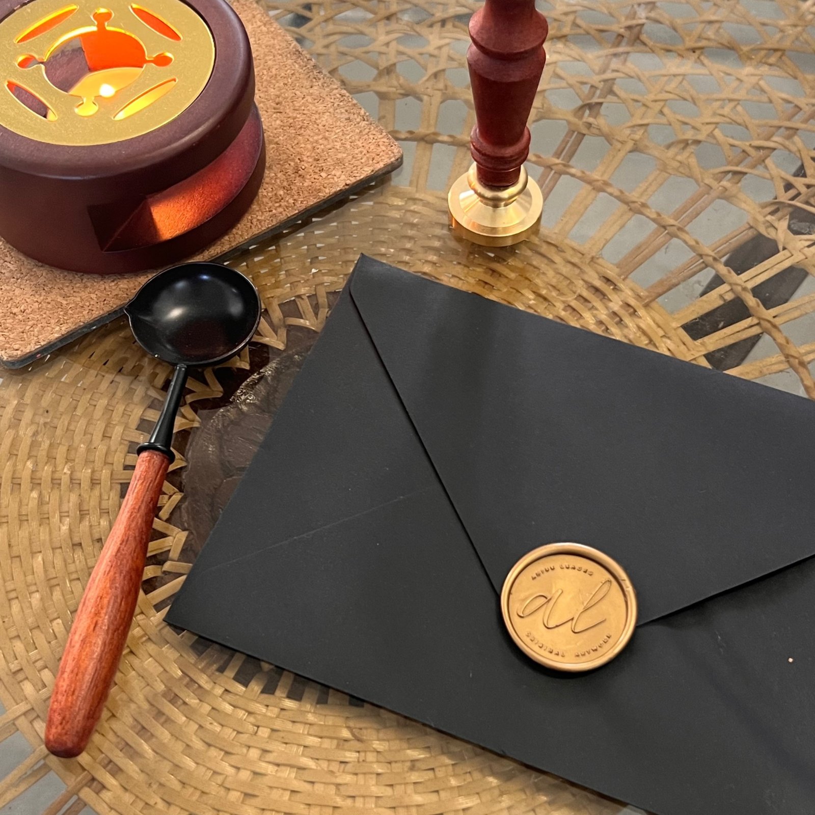 The Soul Compass collectible postcard presented inside a black envelope sealed with a gold wax seal.